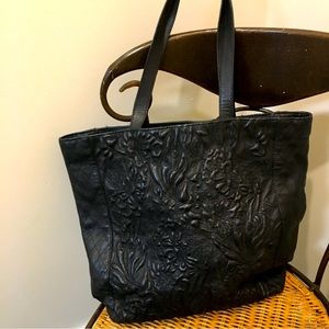 Antik Batik embossed black leather bag.